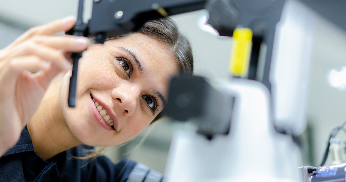 Lux Research Header 3 Woman looking at equipment 