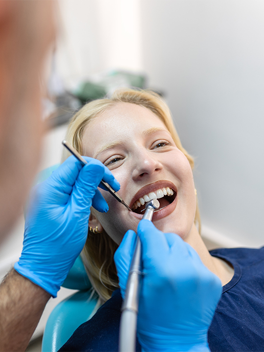 Dentalxchange Portrait 3 Patient being seen by dentist