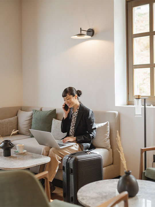 Single Digits Portrait 3 woman on phone working on laptop