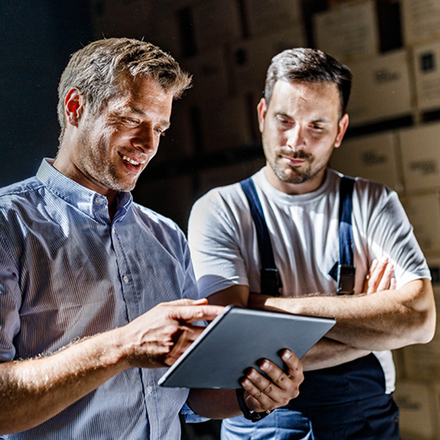  Buyers Edge Portrait 3 men pointing at tablet