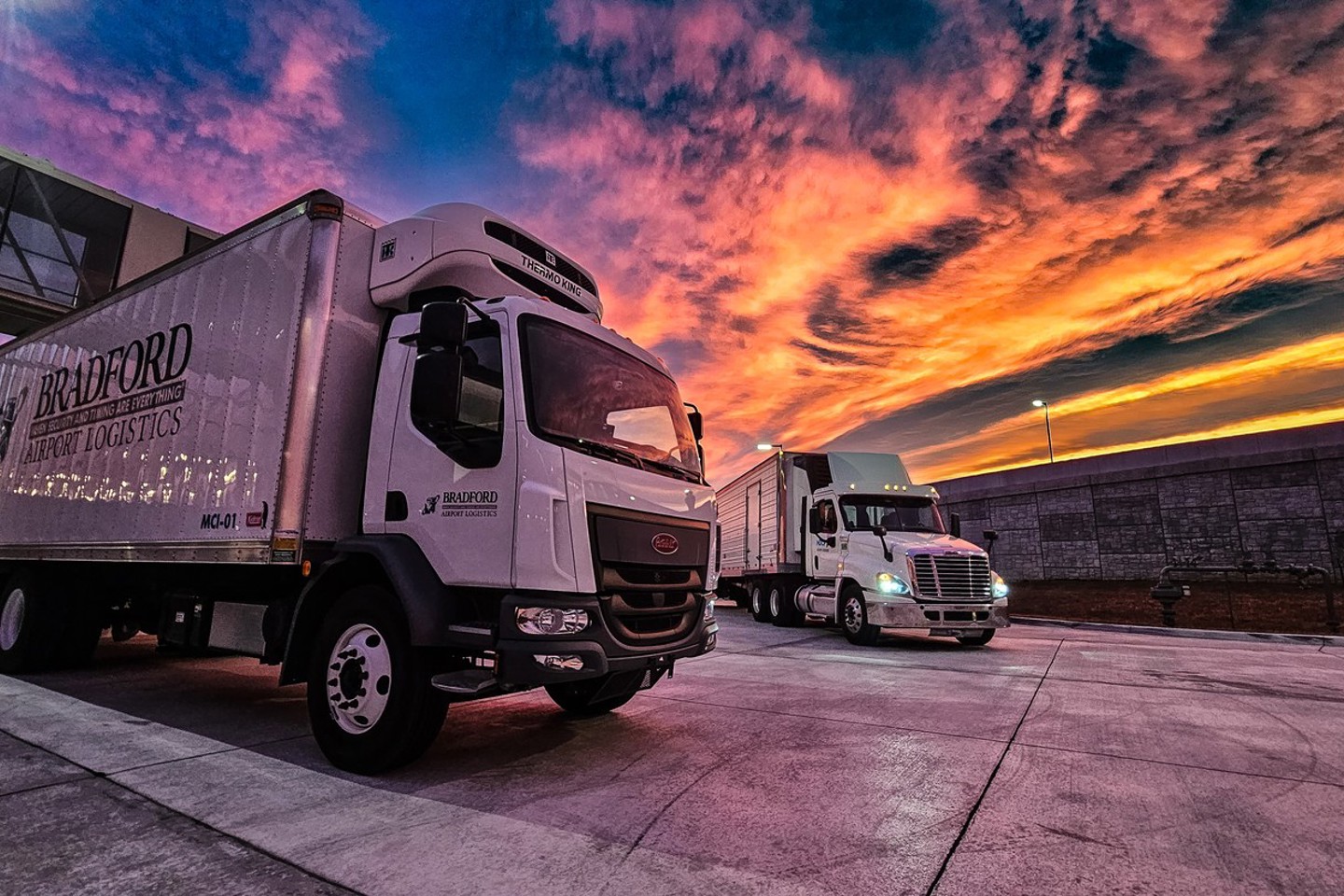 image of trucks at sunset