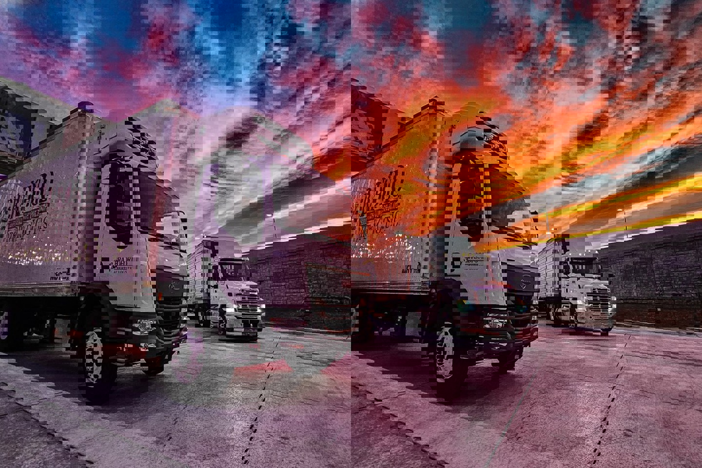 image of trucks at sunset