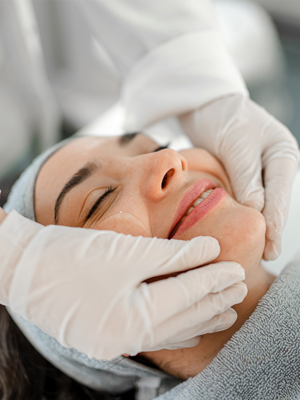 Integrated Dermatology Portrait 1 woman smiling getting a facial