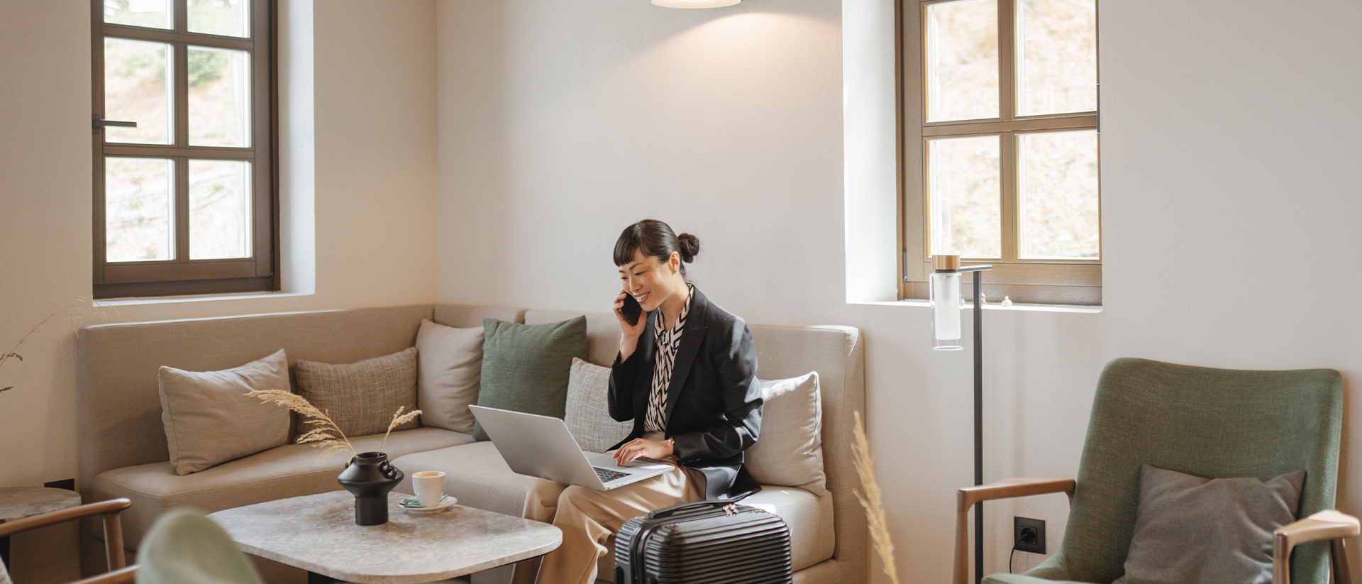 Single Digits Header 3 Woman sat on sofa working