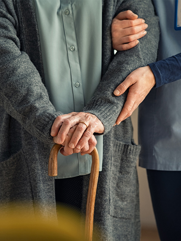 TEAM Portrait 1 old person holding onto walking stick