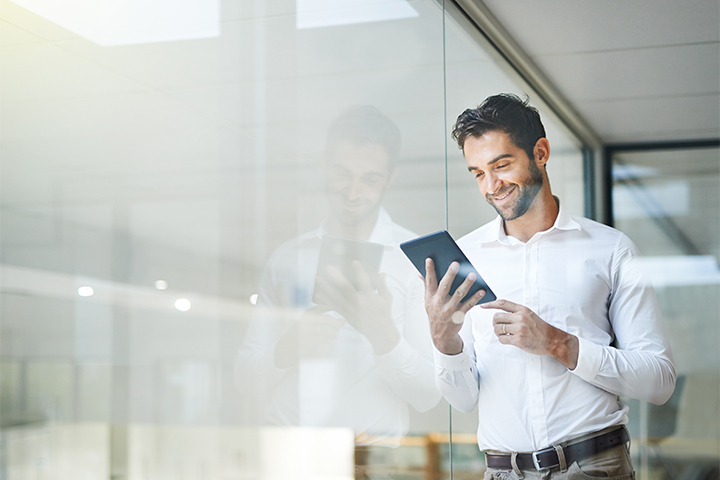 Man looking at tablet image