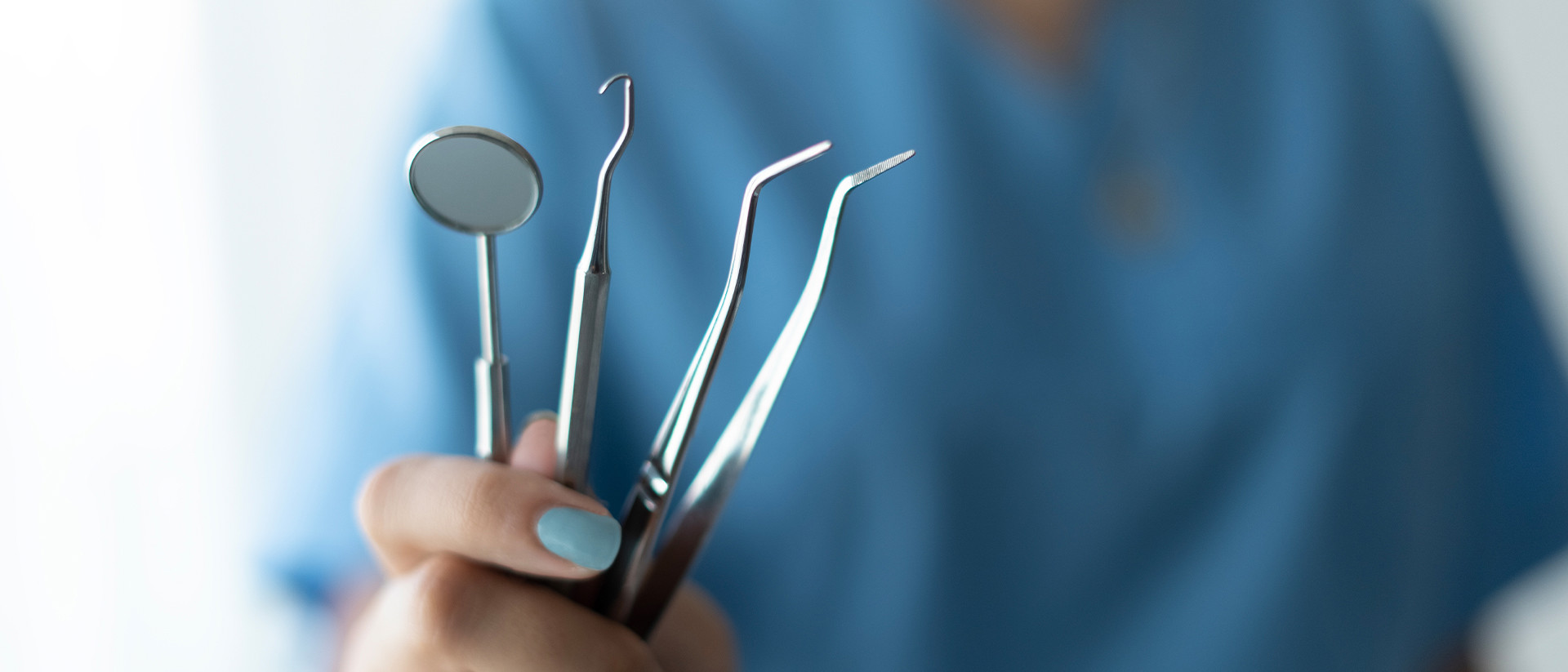 Membersy Header 3 Dental tools in hand