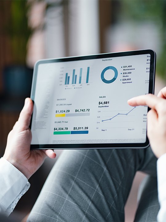 image of a tablet with charts on