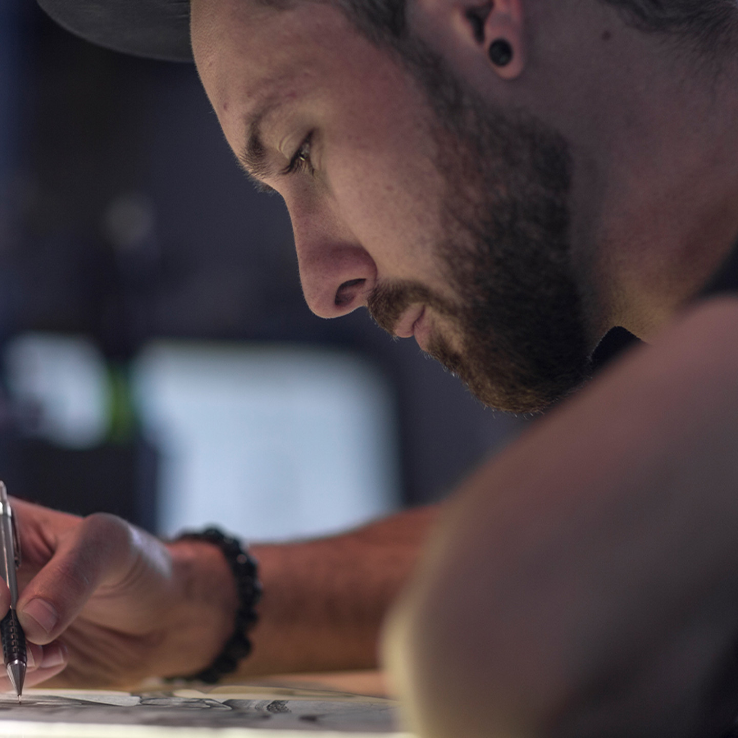 OrangeLogic Header 1 Man writing